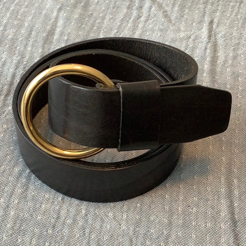 A black Tall Girl belt with brass coloured hardware/clasp.